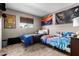 Neutral bedroom featuring two beds with sporty decor and flags at 809 N 95Th St, Mesa, AZ 85207