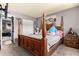 Charming bedroom with a four-poster bed and wood furnishings at 809 N 95Th St, Mesa, AZ 85207