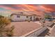 Well-maintained single-story home featuring desert landscaping, a covered porch, and street parking at 809 N 95Th St, Mesa, AZ 85207