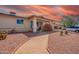 Inviting single-story home featuring desert landscaping, a covered front porch, and a convenient driveway for parking at 809 N 95Th St, Mesa, AZ 85207