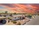 Well-maintained home features desert landscaping, a covered porch, and a side carport for additional parking at 809 N 95Th St, Mesa, AZ 85207