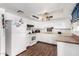 Efficient kitchen features white cabinets and hardwood floors at 809 N 95Th St, Mesa, AZ 85207