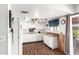 Efficient kitchen features white cabinets and hardwood floors at 809 N 95Th St, Mesa, AZ 85207