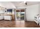 Open-concept kitchen with a sliding glass door and wood accents at 809 N 95Th St, Mesa, AZ 85207