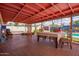 Relaxing covered patio with dining and lounge seating overlooking pool at 809 N 95Th St, Mesa, AZ 85207