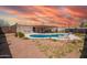 Serene backyard featuring a refreshing pool surrounded by desert landscape and seating at 809 N 95Th St, Mesa, AZ 85207