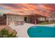 Sparkling pool area with patio seating and vibrant landscaping for outdoor enjoyment at 809 N 95Th St, Mesa, AZ 85207