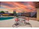 Relaxing pool area featuring comfortable seating and artistic mural creating a private oasis at 809 N 95Th St, Mesa, AZ 85207