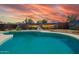 Beautiful pool and deck area with vibrant mural, ideal for outdoor relaxation and entertainment at 809 N 95Th St, Mesa, AZ 85207