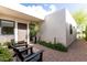 Inviting front porch featuring modern design with seating and desert landscaping at 8754 E Via De Sereno --, Scottsdale, AZ 85258
