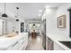 Well-lit kitchen with stainless steel appliances and an adjacent dining area at 8754 E Via De Sereno --, Scottsdale, AZ 85258