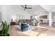 Spacious living room with wood flooring, contemporary decor, and ample seating at 8754 E Via De Sereno --, Scottsdale, AZ 85258