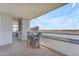 A beautiful balcony seating area with views of the city skyline and lake at 945 E Playa Del Norte Dr # 4017, Tempe, AZ 85288