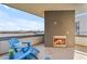 Relax on the balcony with lake views, fireplace and adirondack chairs at 945 E Playa Del Norte Dr # 4017, Tempe, AZ 85288