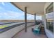 Spacious balcony with lake views, lounge chairs, and a dining table at 945 E Playa Del Norte Dr # 4017, Tempe, AZ 85288