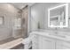 Modern bathroom featuring a glass-enclosed shower, sleek vanity, and contemporary lighting at 945 E Playa Del Norte Dr # 4017, Tempe, AZ 85288