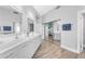Bathroom boasts double sinks, modern vanity, and a mirrored closet door showcasing a bedroom area at 945 E Playa Del Norte Dr # 4017, Tempe, AZ 85288