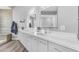 Bright bathroom features double sinks, modern lighting, and sleek cabinetry with wood look floors at 945 E Playa Del Norte Dr # 4017, Tempe, AZ 85288