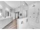 Bright, modern bathroom with a walk-in shower and double sink vanity with wood look tile floors at 945 E Playa Del Norte Dr # 4017, Tempe, AZ 85288