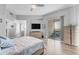 Bright bedroom boasts a private balcony, wood floors, and flat screen tv at 945 E Playa Del Norte Dr # 4017, Tempe, AZ 85288