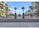 Beautiful courtyard with seating areas, palm trees, and manicured landscaping create a serene outdoor space at 945 E Playa Del Norte Dr # 4017, Tempe, AZ 85288