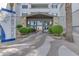 Elegant building entrance with stone accents, manicured landscaping, and a welcoming ambiance at 945 E Playa Del Norte Dr # 4017, Tempe, AZ 85288