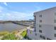 Building exterior with lake view, bridge, and sidewalks at 945 E Playa Del Norte Dr # 4017, Tempe, AZ 85288