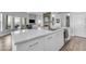 Bright kitchen features white cabinets, an island, stainless steel appliances and marble countertops at 945 E Playa Del Norte Dr # 4017, Tempe, AZ 85288
