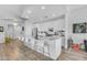 Modern kitchen with glossy white cabinets, stainless appliances and a large, marble-style island at 945 E Playa Del Norte Dr # 4017, Tempe, AZ 85288