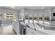 Modern kitchen with a large center island, marble countertops, stainless steel appliances, and city views at 945 E Playa Del Norte Dr # 4017, Tempe, AZ 85288