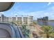 A view of the lake with palm trees, waterfront condos and high rise apartments at 945 E Playa Del Norte Dr # 4017, Tempe, AZ 85288