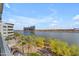 An outdoor view of the lake, palm trees, and high rise buildings at 945 E Playa Del Norte Dr # 4017, Tempe, AZ 85288