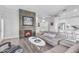 Stylish living room featuring a modern fireplace, sleek furniture, and an open-concept design at 945 E Playa Del Norte Dr # 4017, Tempe, AZ 85288