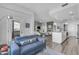 Open concept living area with modern furnishings, fireplace, and balcony access, flowing into the kitchen at 945 E Playa Del Norte Dr # 4017, Tempe, AZ 85288
