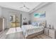 Bright main bedroom with balcony access, featuring a ceiling fan and contemporary decor at 945 E Playa Del Norte Dr # 4017, Tempe, AZ 85288