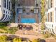 Aerial view of a meticulously designed community pool with palm trees and lounge areas for ultimate relaxation at 945 E Playa Del Norte Dr # 4017, Tempe, AZ 85288