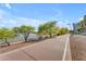 Scenic community walking path along the water with lush trees and landscaping at 945 E Playa Del Norte Dr # 4017, Tempe, AZ 85288