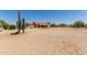 Expansive backyard with desert landscaping, offering privacy and space for outdoor activities at 9625 W Prospector Dr, Queen Creek, AZ 85144