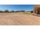 Expansive backyard with a combination of desert landscape and mountain views at 9625 W Prospector Dr, Queen Creek, AZ 85144