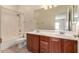 This bathroom has double sinks and a shower over tub at 9625 W Prospector Dr, Queen Creek, AZ 85144