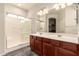 Bathroom with a walk-in shower, double vanity, and wood floor at 9625 W Prospector Dr, Queen Creek, AZ 85144