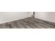 This bedroom boasts vinyl floors and white trim at 9625 W Prospector Dr, Queen Creek, AZ 85144