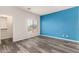 This bedroom is light and airy and features vinyl floors at 9625 W Prospector Dr, Queen Creek, AZ 85144