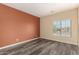 This bedroom boasts vinyl floors and plenty of light from the window at 9625 W Prospector Dr, Queen Creek, AZ 85144