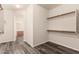 Walk-in closet with wood floors and shelves at 9625 W Prospector Dr, Queen Creek, AZ 85144