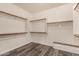 Walk-in closet with shelves and wood floors at 9625 W Prospector Dr, Queen Creek, AZ 85144