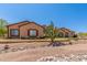 Inviting single-story home with desert landscaping, rock accents, and a tiled roof at 9625 W Prospector Dr, Queen Creek, AZ 85144