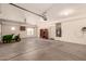 Spacious garage with high ceilings, bright lighting, and room for storage and parking at 9625 W Prospector Dr, Queen Creek, AZ 85144