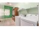 The laundry room features built-in shelves and a large cabinet at 9625 W Prospector Dr, Queen Creek, AZ 85144