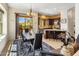 Open dining room with modern chandelier, access to the backyard and the kitchen at 9653 E Sidewinder Trl, Scottsdale, AZ 85262